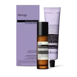 A pump bottle of Solais Replenishing Hand Serum and a tube of Eleos Aromatique Hand Balm together in a carboard box.