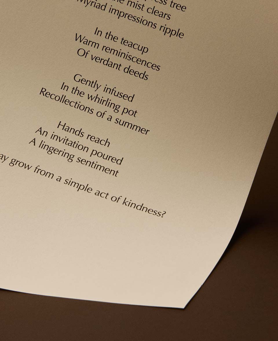 Poem lines centered on a curved cream page over a warm brown background.
